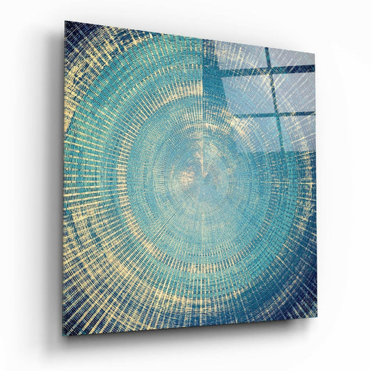 Square glass panel with concentric circular pattern in teal, cream, and navy blue, displayed at an angle showing depth and shadow.