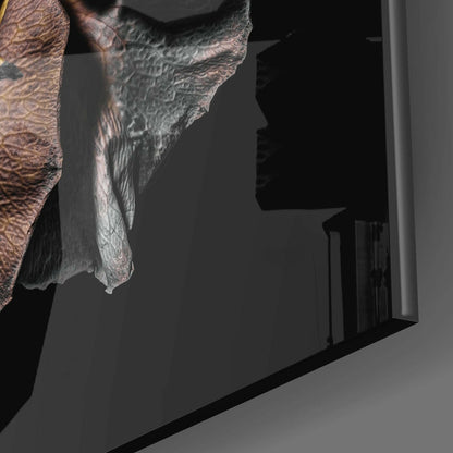 Close-up of dried rose glass wall art showing textured rose petals in brown and gray tones against dark background.