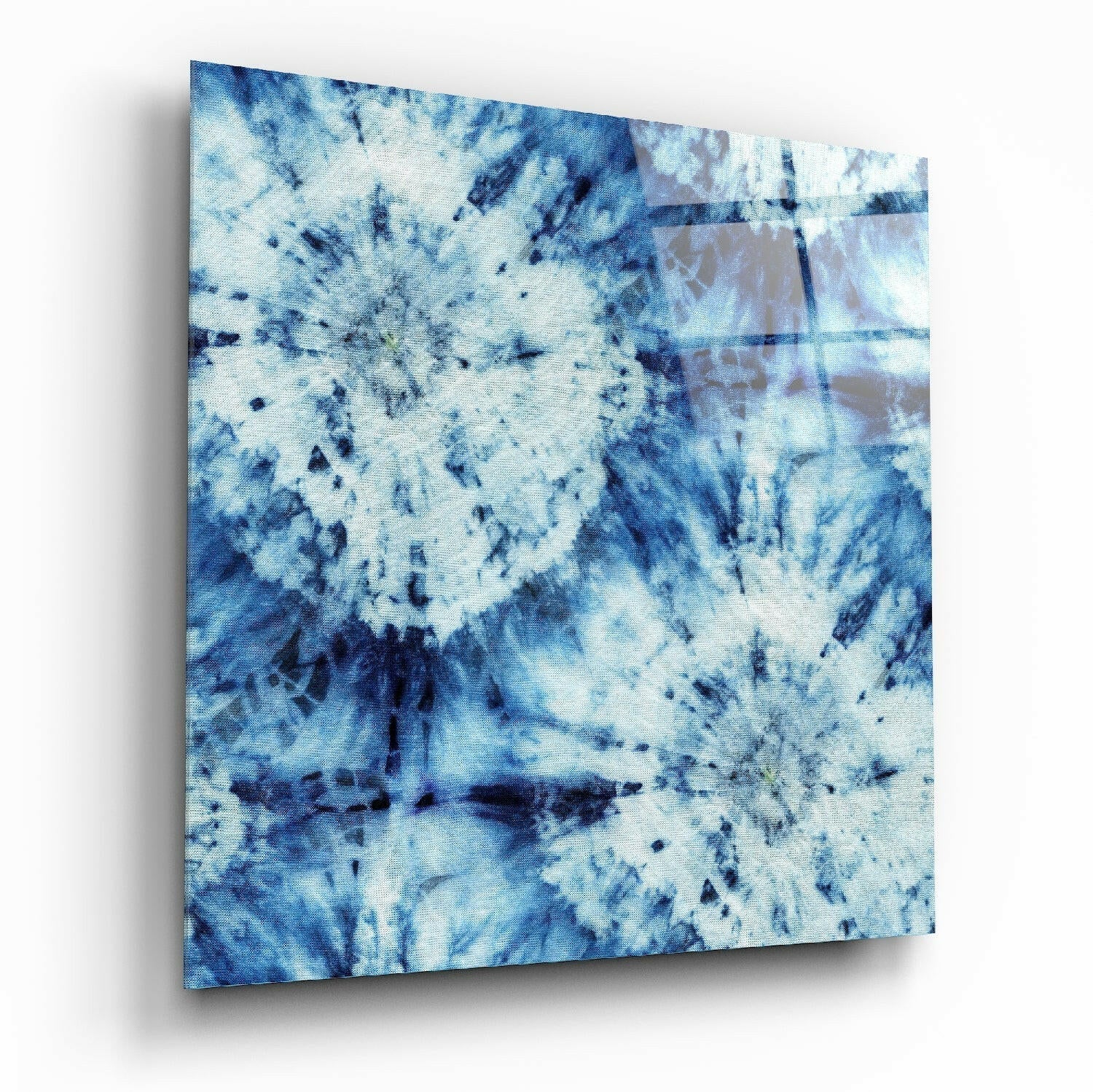 Blue and white textured glass wall art panel displayed at an angle, showing mottled abstract pattern with dark streaks and speckles.