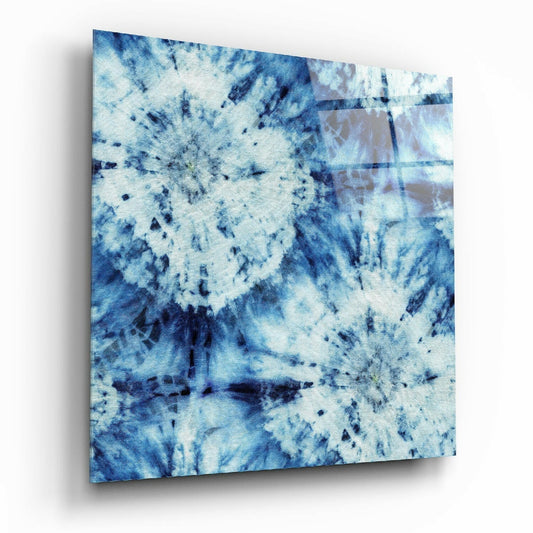 Blue and white textured glass wall art panel displayed at an angle, showing mottled abstract pattern with dark streaks and speckles.