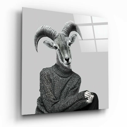 Black and white portrait of an antelope wearing a textured sweater, displayed on a glass wall panel with window reflections.