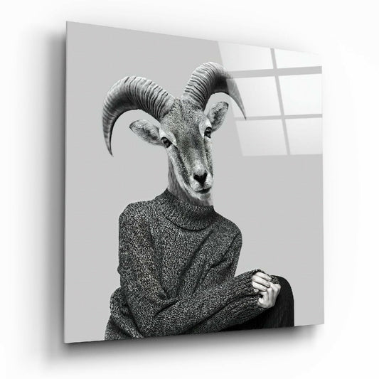 Black and white portrait of an antelope wearing a textured sweater, displayed on a glass wall panel with window reflections.