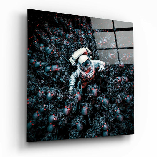 Angled perspective view of glass wall art showing astronaut figure surrounded by dark skeletal forms with red glowing eyes against black background.