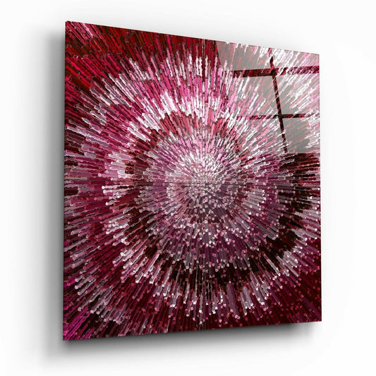 Square glass wall art panel displayed at an angle showing a radial burst pattern in shades of pink, magenta, and white with dark burgundy edges.
