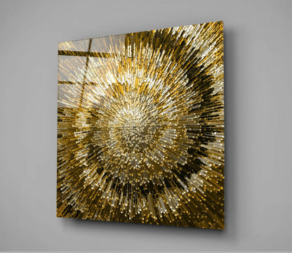 Square gold and white glass wall art with radiating striped pattern mounted on gray wall, angled perspective view.