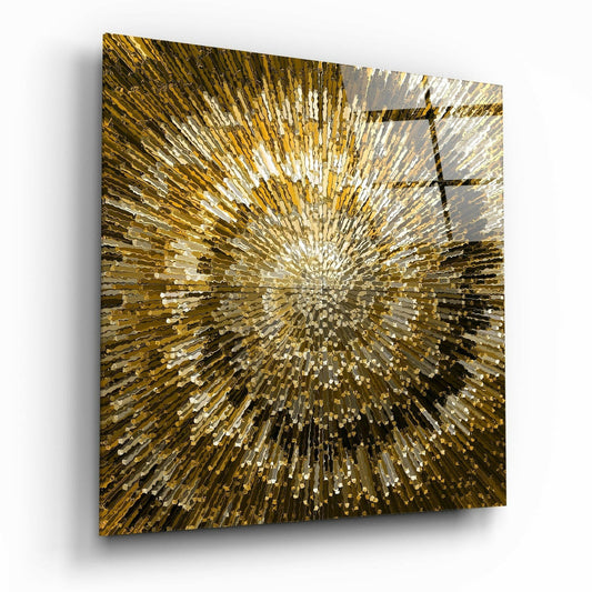 Square glass wall art with radiating golden and white rectangular tiles bursting outward from center, displayed at angle showing depth and shadow.