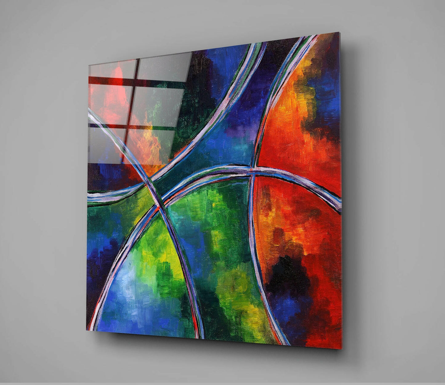 Colorful glass wall art panel mounted on gray wall displaying vibrant curved lines dividing sections of red, blue, green, and orange hues.