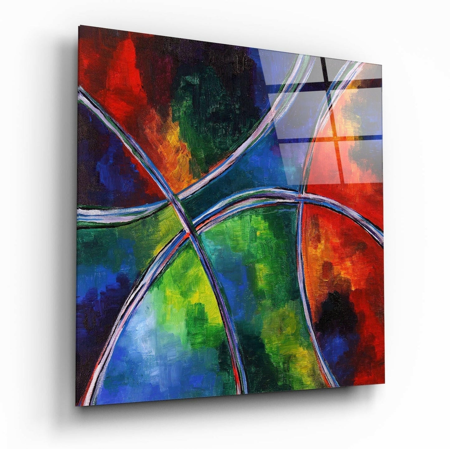 Angled perspective of a colorful glass wall art panel featuring vibrant red, blue, green, and yellow sections divided by white and dark curved lines.