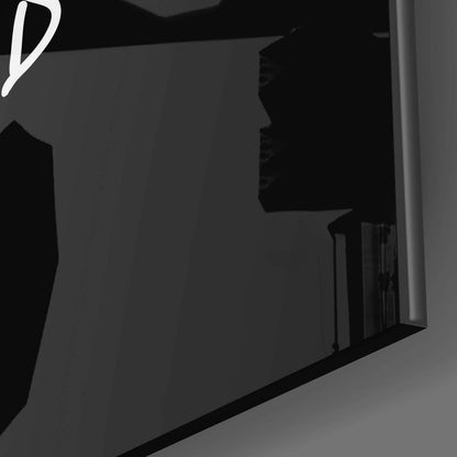 Dark interior corner view showing "So What?" glass wall art mounted on gray wall beside doorframe.