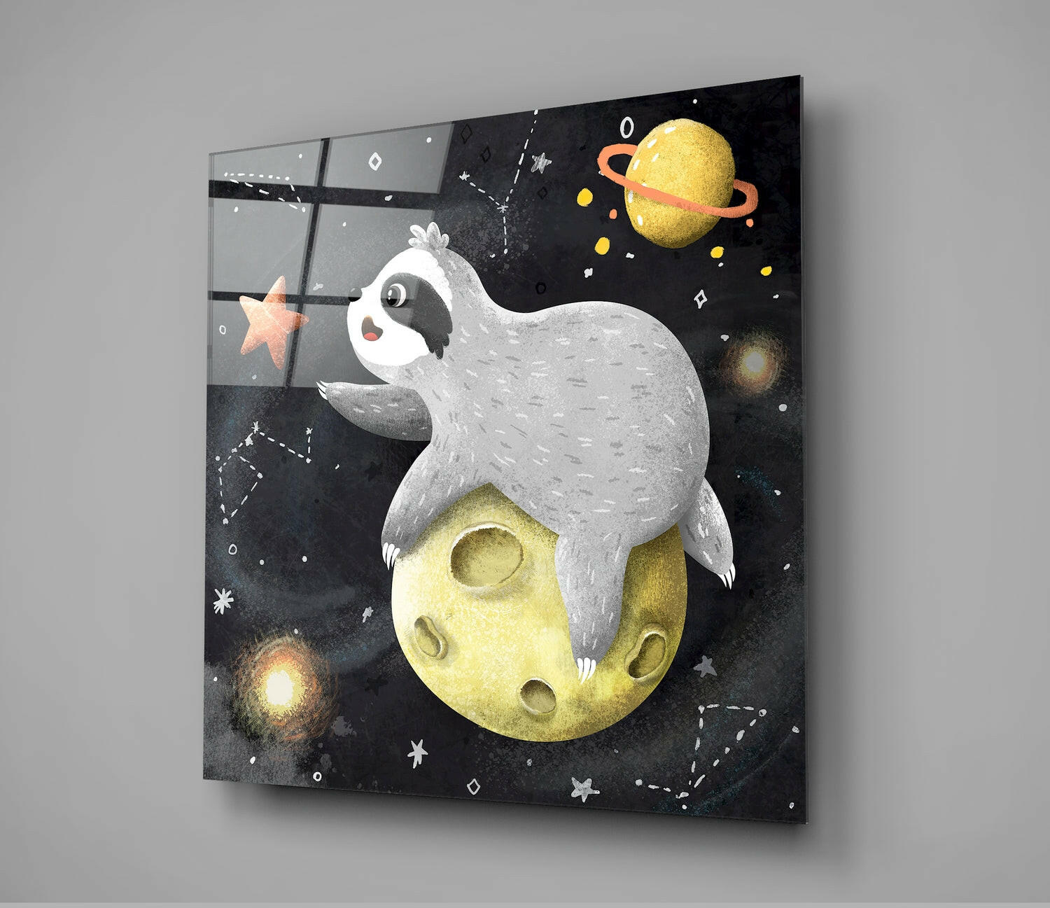 Angled view of glass wall art depicting a white sleeping creature on a yellow moon surrounded by planets and stars against a black background.