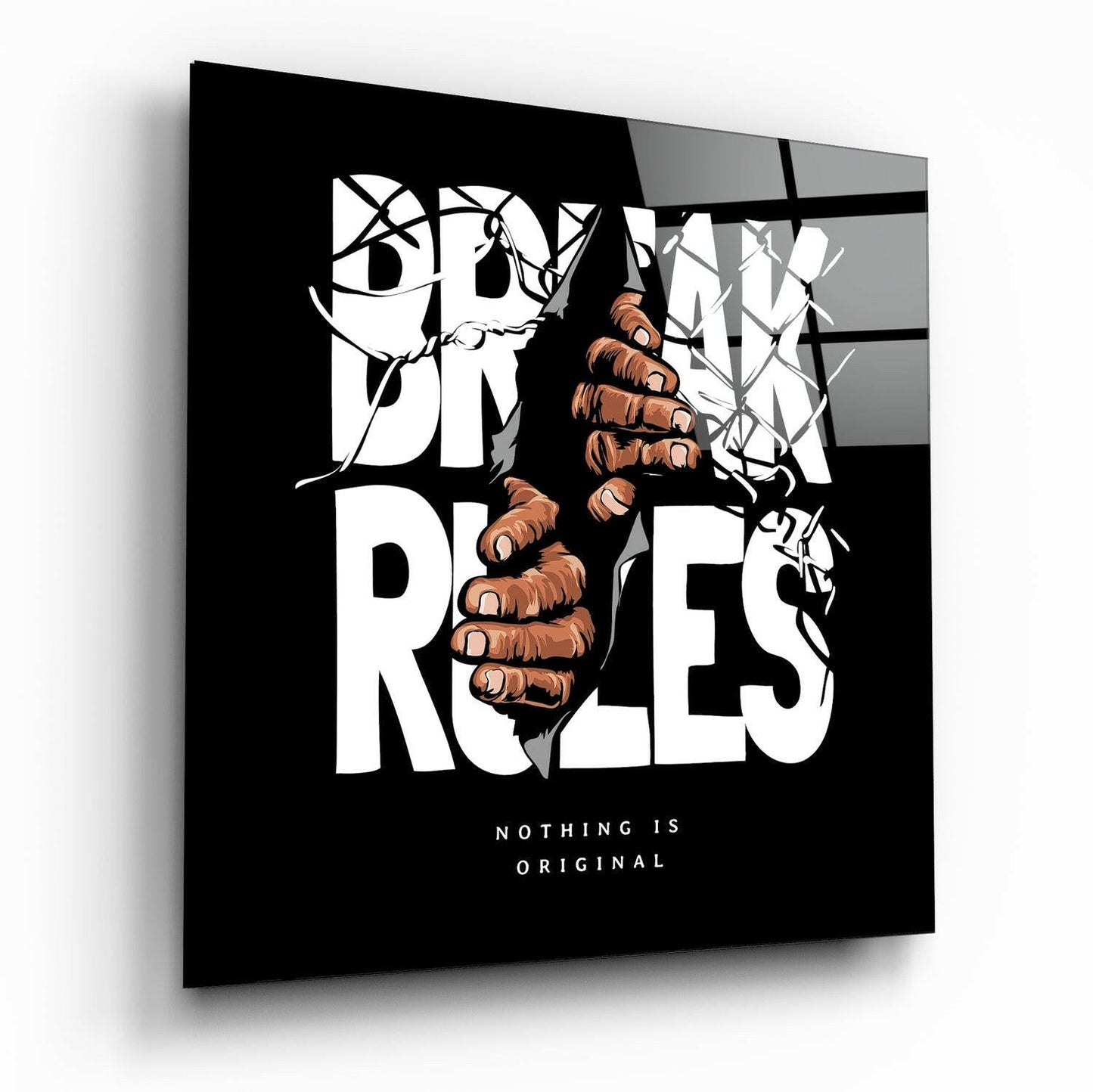 Rule Breaker glass wall art displayed at an angle, showing a fist breaking through vines with black background and white typography reading "Nothing is Original.