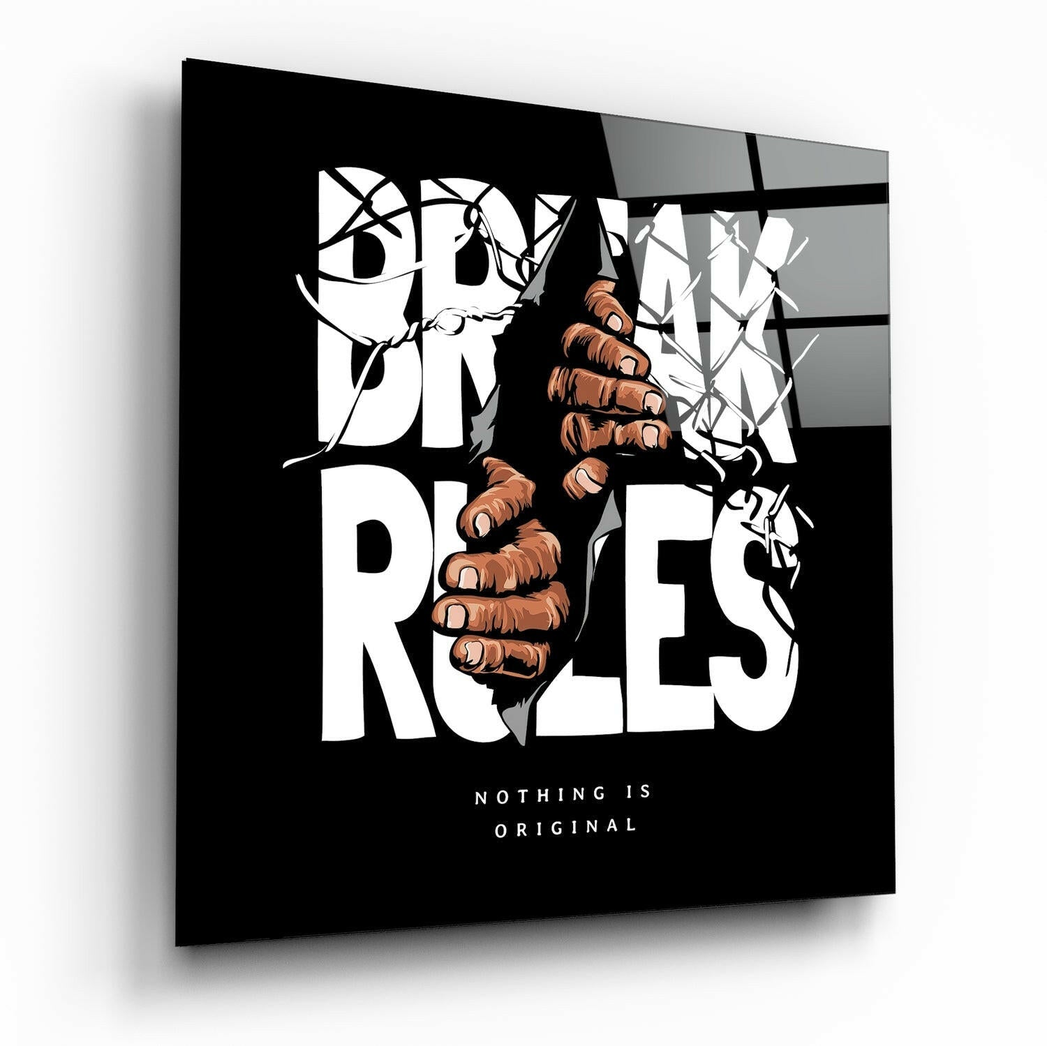 Rule Breaker glass wall art displayed at an angle, showing a fist breaking through vines with black background and white typography reading "Nothing is Original.