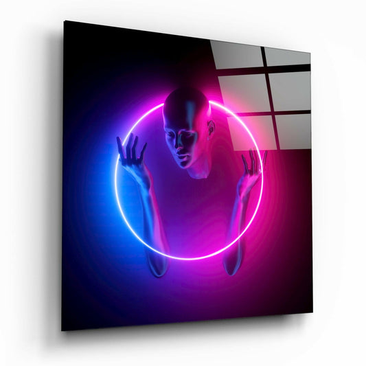 Angled perspective of glass wall art featuring a neon glowing circular ring in pink and blue surrounding a translucent human figure silhouette.