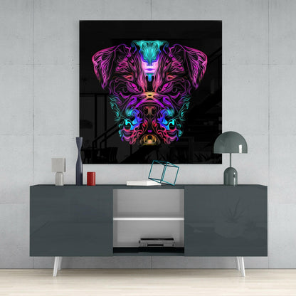 Neon angry dog glass wall art with magenta, cyan, and purple colors displayed above gray media console in modern interior setting.