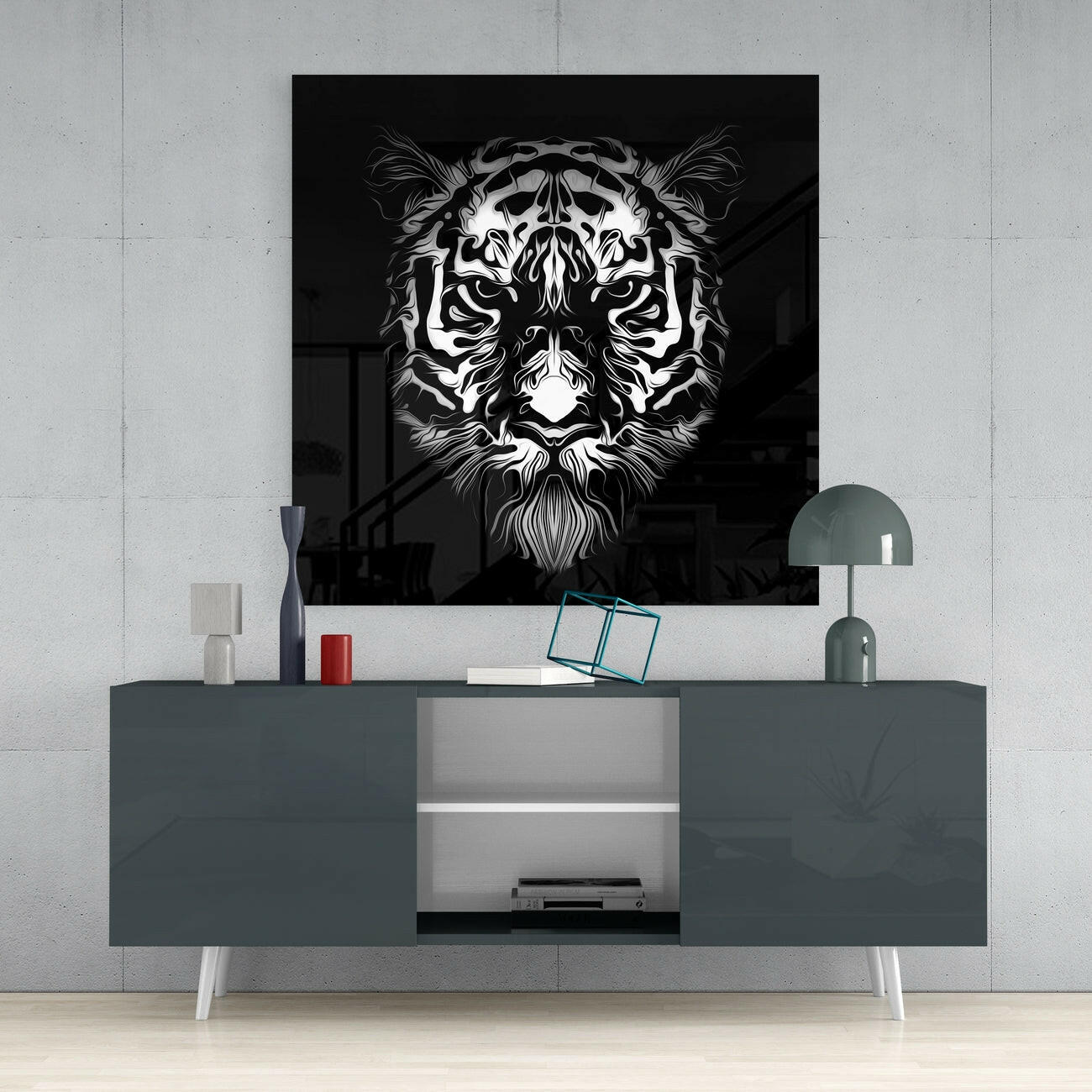 Black and white tiger face glass wall art displayed above gray media console in modern interior setting.