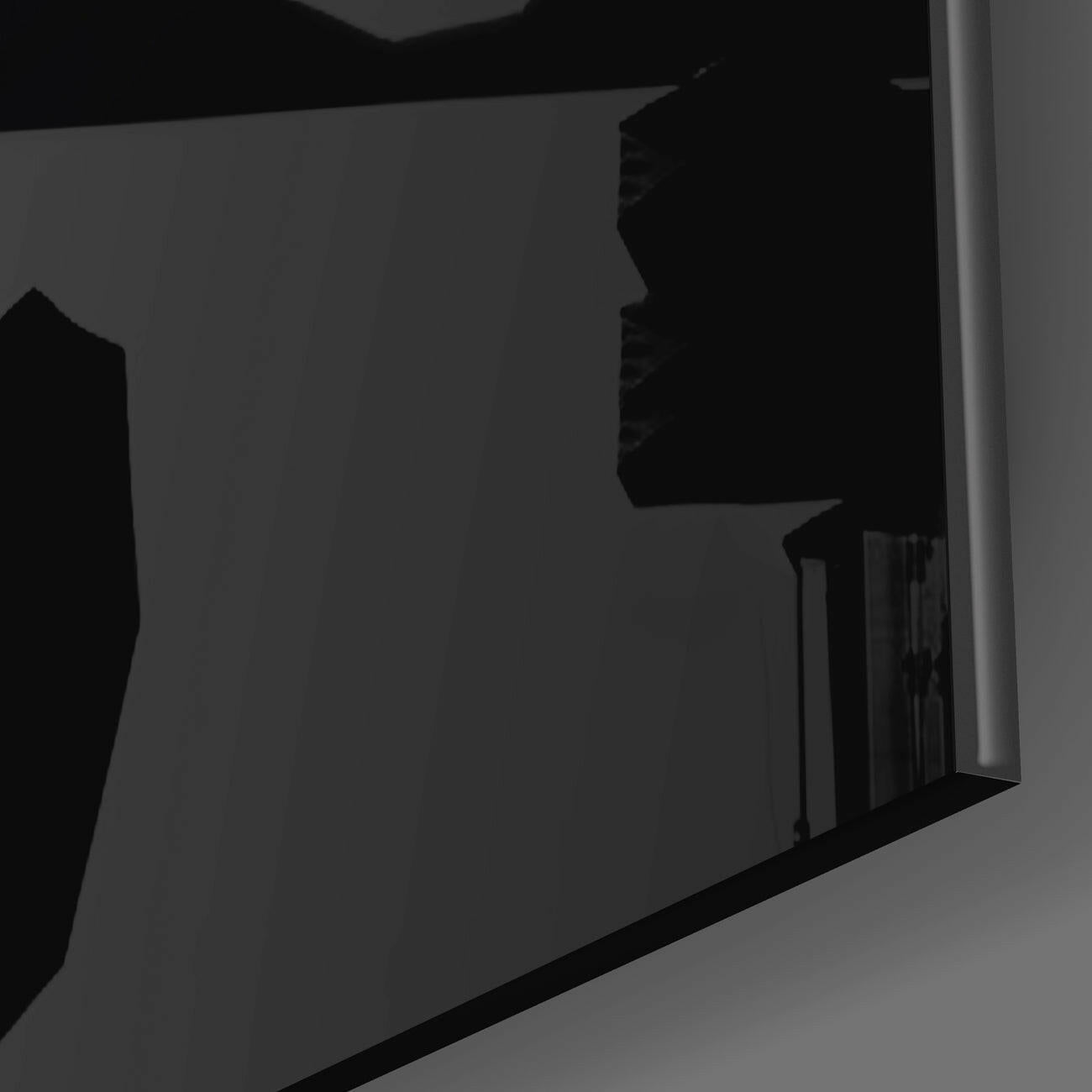 Close-up side view of black glass panel showing punk dog silhouette profile against gray background.