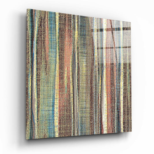 Angled perspective of a textured glass wall panel displaying vertical stripes in earthy tones of brown, rust, teal, and cream.