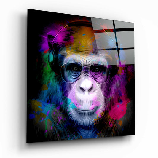 Colorful glass wall art featuring a stylized primate wearing headphones and aviator sunglasses against a vibrant multicolored abstract background.