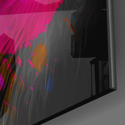 Colorful abstract glass wall art with pink, orange, and blue splattered paint design displayed at an angle against dark background.