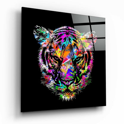 Angled view of a glass wall panel displaying a neon-colored tiger face with magenta, cyan, yellow, and orange strokes on black background.