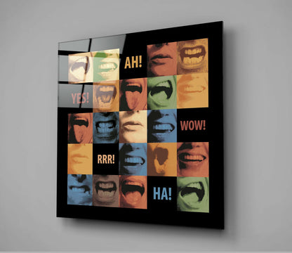 Glass wall art displaying a grid of colorful close-up mouth photographs with text reading "AH!", "YES!", "WOW!", "RRR!", and "HA!" on black background.