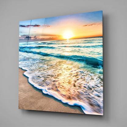 Beach sunset with rolling waves and golden light reflecting on water, printed on glass wall panel.