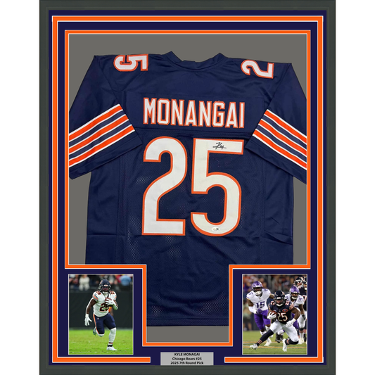 Navy Chicago Bears #25 jersey with orange and white stripes, signed by Kyle Monangai, displayed in frame with two action photos below.