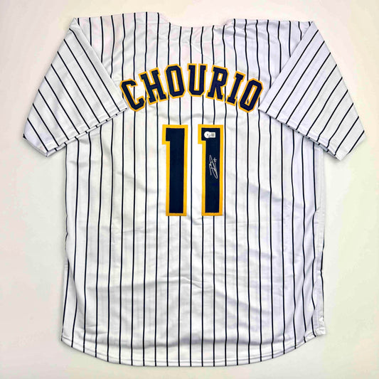 White pinstriped baseball jersey with "CHOURIO" and number 11 in gold and navy lettering, displayed flat lay against neutral background.
