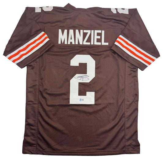 Brown Cleveland Browns football jersey number 2 with Manziel nameplate, displayed flat showing front with white number and signature.