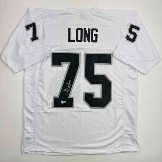 White football jersey with "LONG" and number "75" displayed flat, showing front view with signature visible on the number.