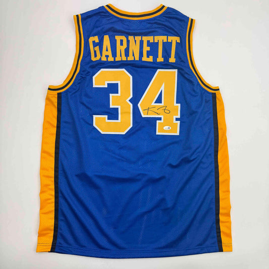 Blue basketball jersey with "GARNETT" and number "34" in yellow and white lettering, displayed flat against white background, back view.