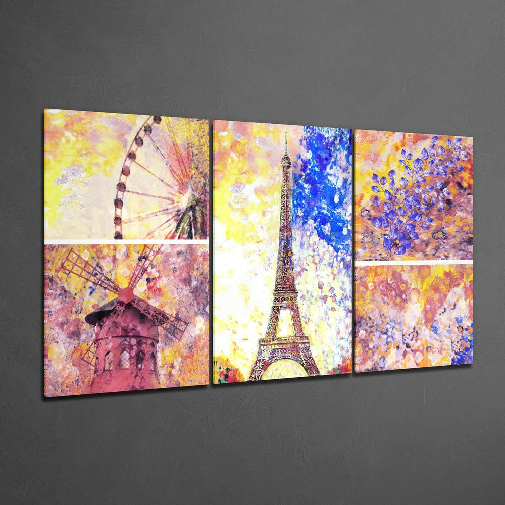 Three colorful glass panels displaying Paris landmarks including the Eiffel Tower, windmill, and Ferris wheel against a gray wall.