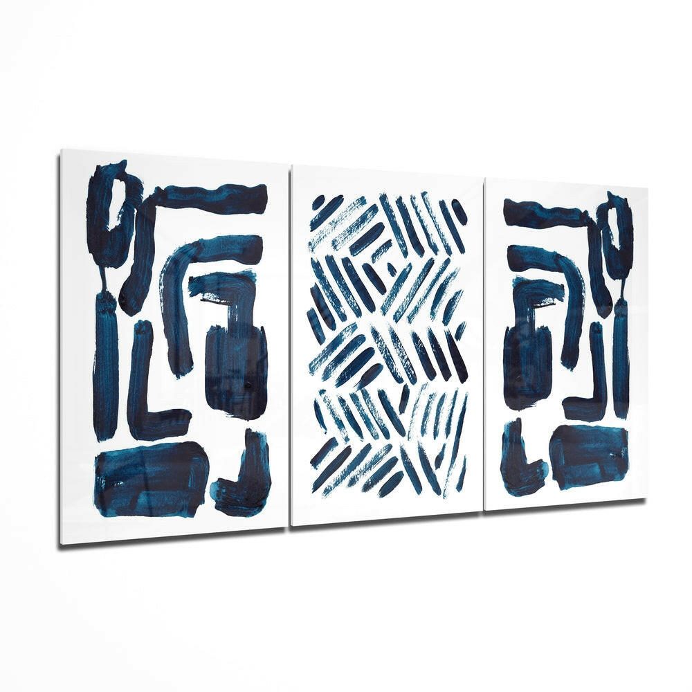 Three-panel glass wall art set displaying navy blue abstract brushstrokes and geometric patterns on white background.
