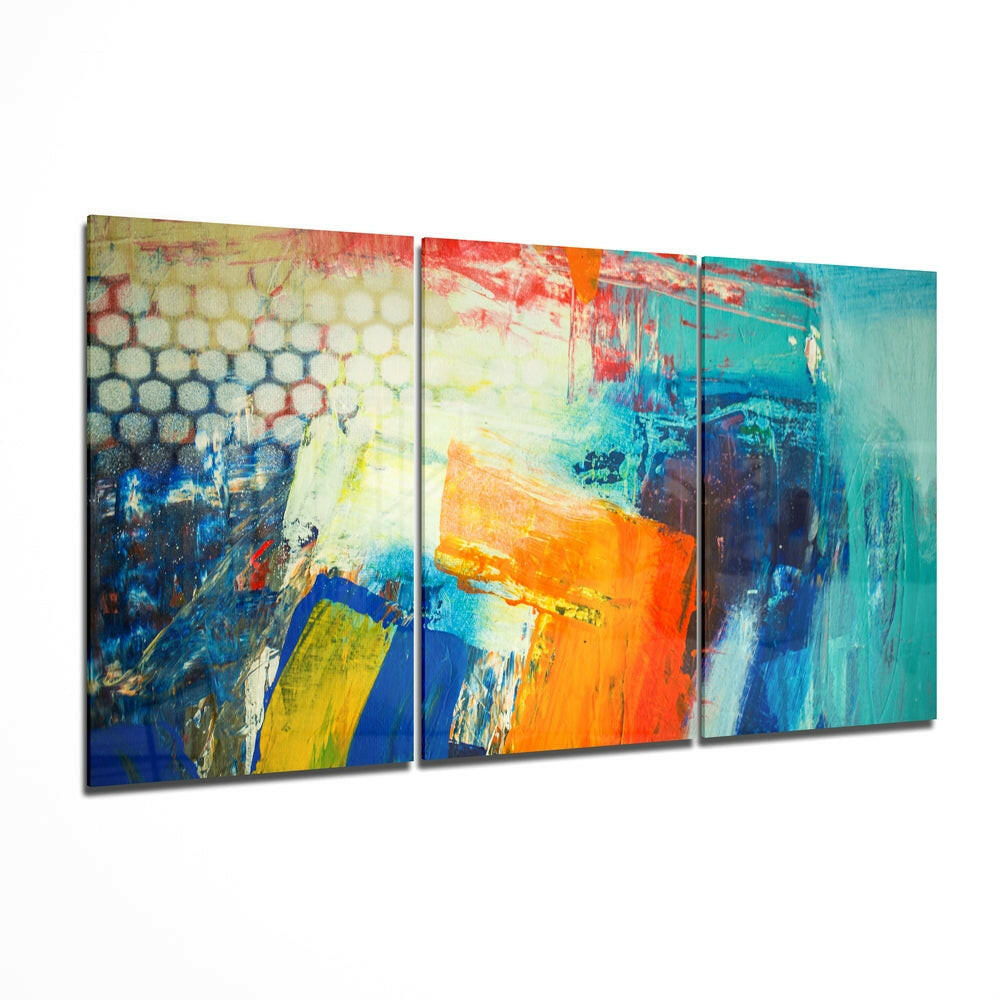 Three-panel glass wall art displaying abstract brushstrokes in turquoise, orange, yellow, and blue arranged at an angled perspective.