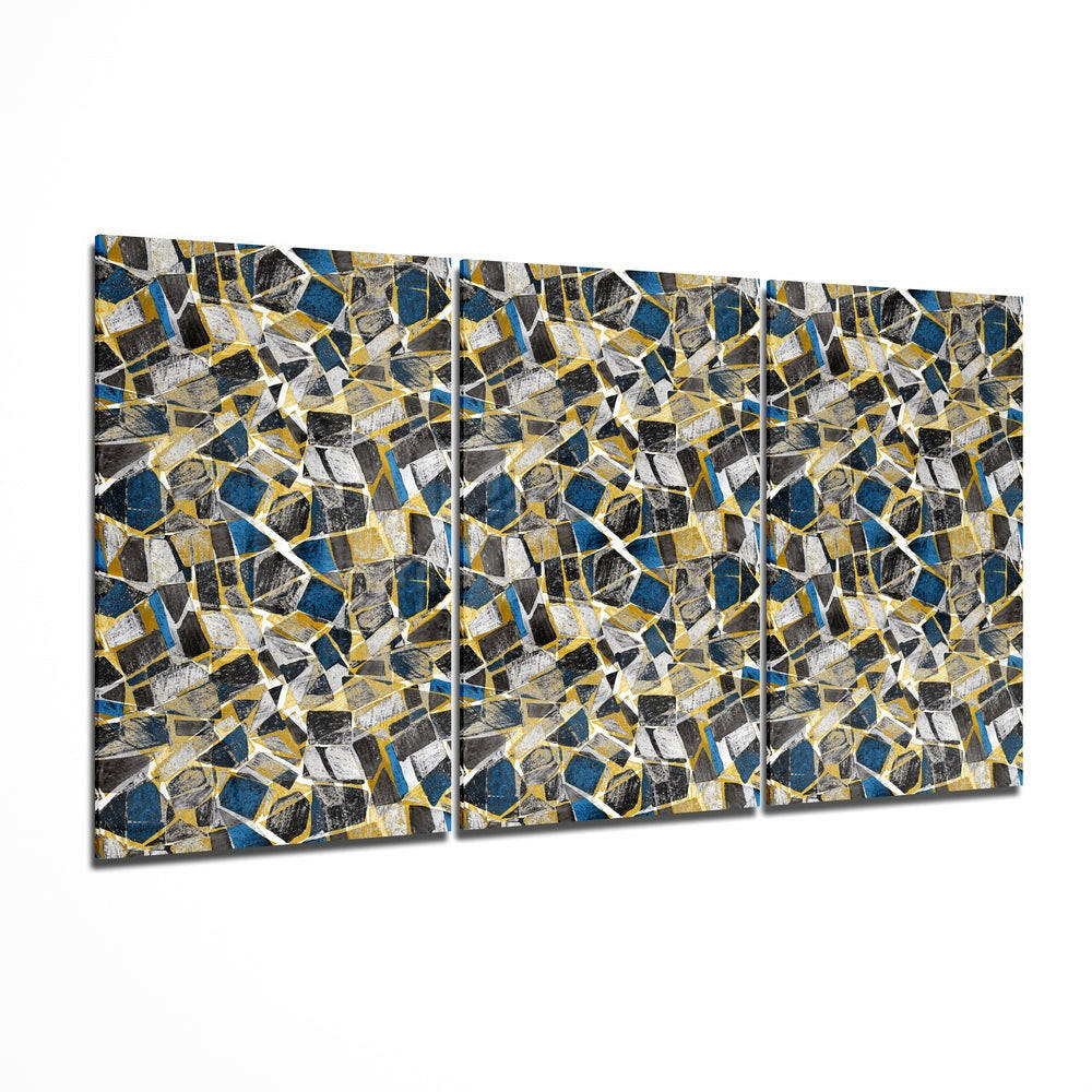 Three-panel glass wall art displaying a geometric mosaic pattern of blue, gold, black, and white angular shapes arranged in a seamless repeating design.