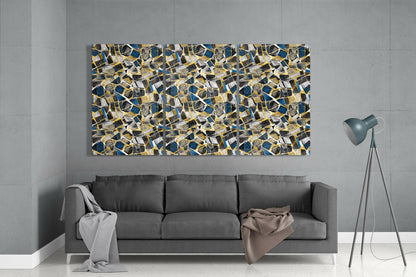 Modern living room featuring a gray sofa beneath a large abstract glass wall art panel with blue, gold, and white mosaic-like shapes.