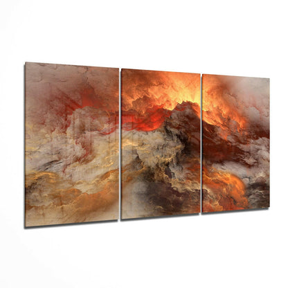 Three-panel glass wall art displaying a volcanic landscape with orange flames, red lava, and tan rocky terrain in an abstract style.