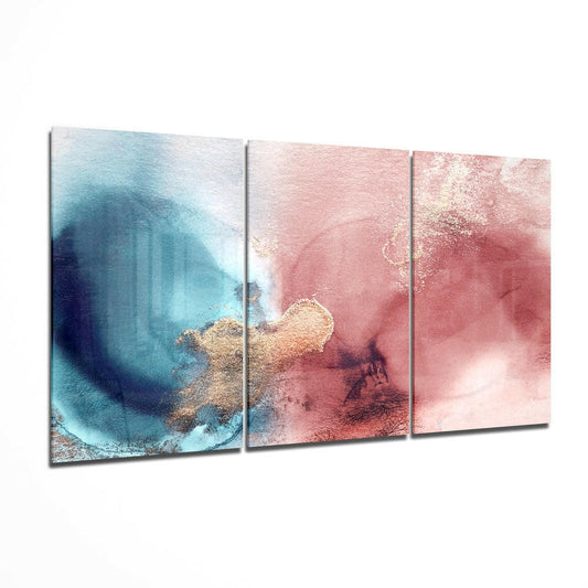 Three-panel glass wall art displaying abstract watercolor gradients transitioning from turquoise blue to blush pink with gold accents.