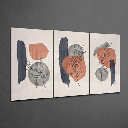 Three framed glass panels displaying abstract botanical designs with navy brushstrokes, terracotta and gray shapes, and minimalist line-drawn plants on cream backgrounds.