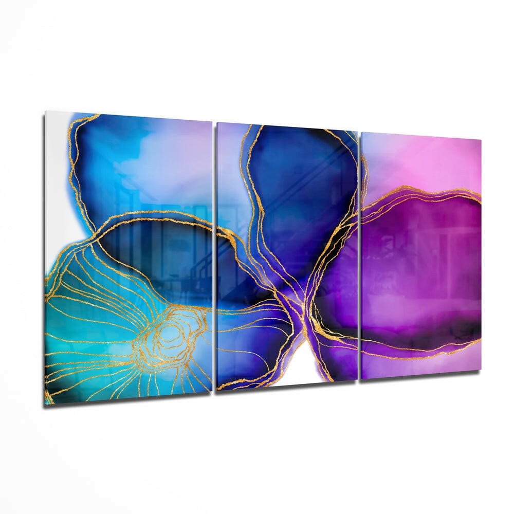 Three-panel glass wall art displaying abstract organic shapes with gold line detailing on blue, purple, and pink gradient backgrounds.