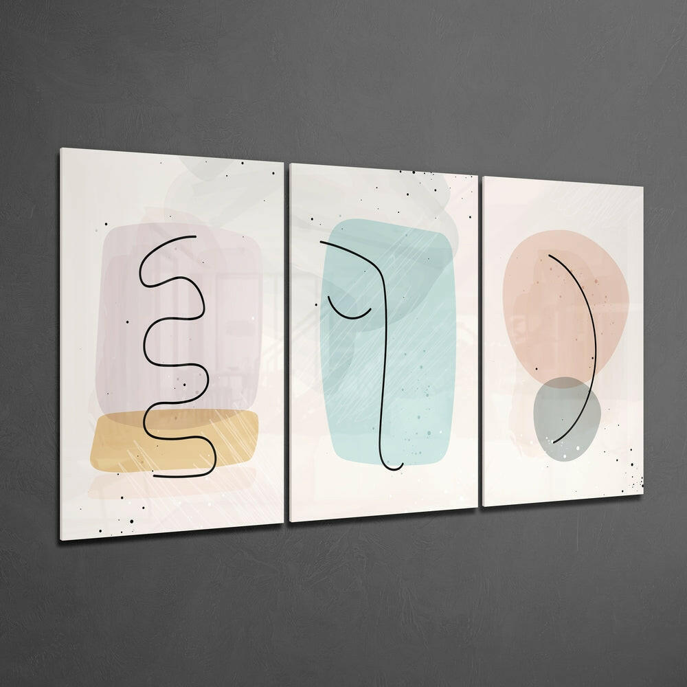 Three framed glass wall art panels featuring abstract line drawings and pastel watercolor shapes in pink, blue, and beige tones displayed on a gray wall.