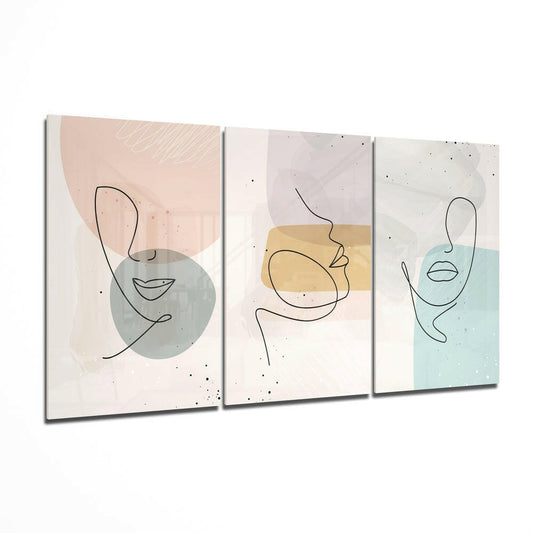 Three-panel glass wall art featuring minimalist line-drawn faces with watercolor shapes in soft pastels and muted tones.