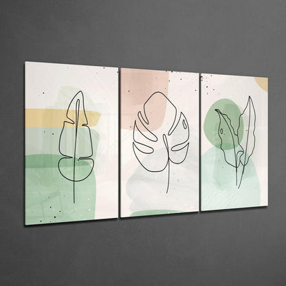 Three framed glass panels with minimalist line-drawn botanical leaves on pastel watercolor backgrounds in cream, pink, and green tones.