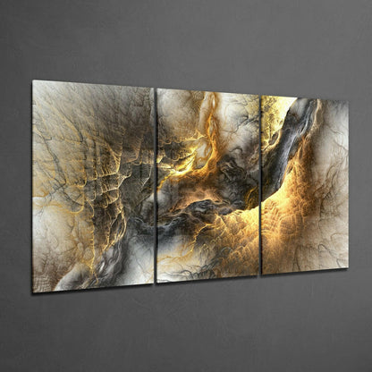 Three-panel yellow lava glass wall art displaying abstract flowing patterns in gold, cream, and charcoal tones mounted on gray wall.