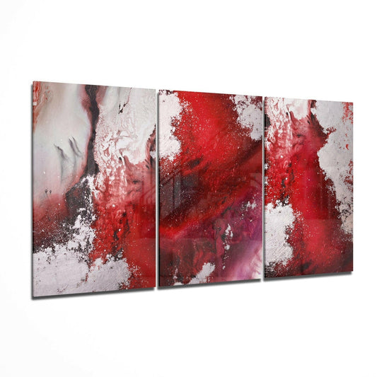 Three-panel abstract red glass wall art displaying splattered red and white patterns with dark accents, arranged in angled perspective view.