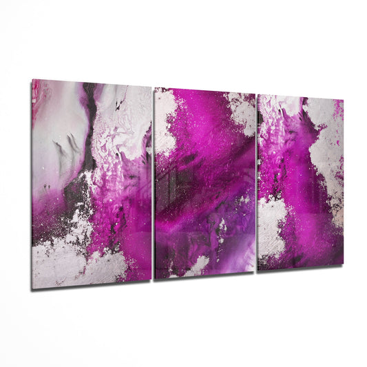 Three-panel fuchsia and white abstract glass wall art displayed at an angle showing vibrant color gradients and textured surfaces.