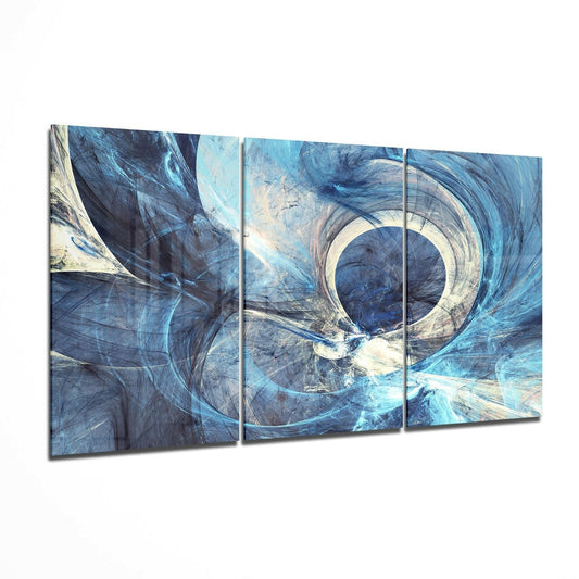 Three-panel glass wall art displaying blue and white swirling abstract fractals with a central circular vortex design.