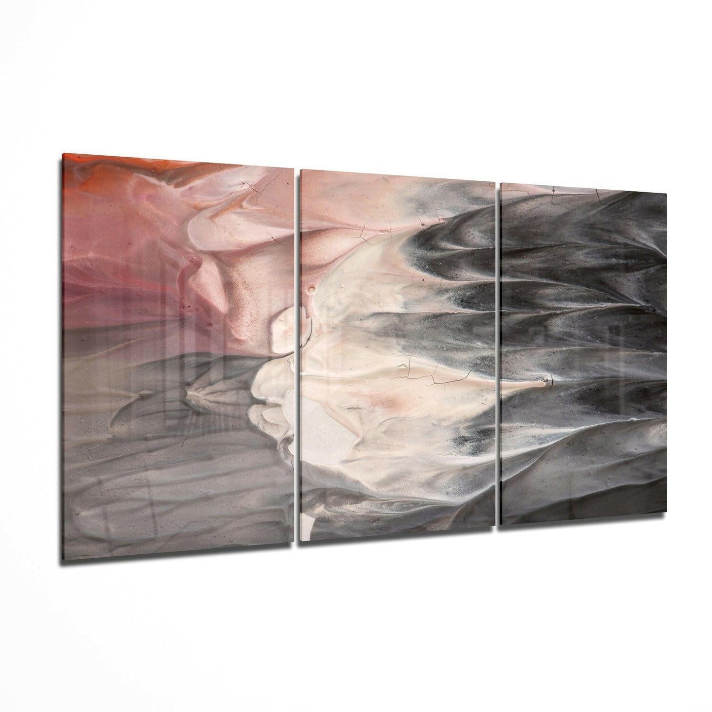 Three-panel glass wall art with abstract layered design in pink, cream, and charcoal tones, displayed at an angle.