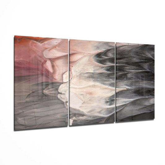 Three-panel glass wall art with abstract layered design in pink, cream, and charcoal tones, displayed at an angle.