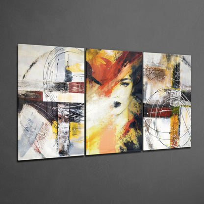 Three-panel glass wall art featuring abstract designs with geometric shapes, warm earth tones, and a stylized female face in the center panel.